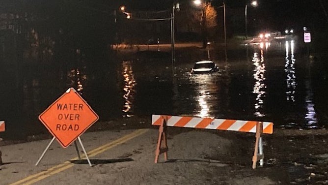 A road closed due to flooding in Lewiston, Maine. Dec. 19, 2023.