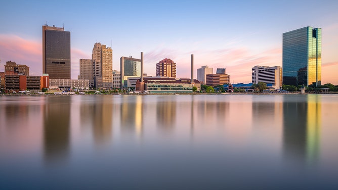 A look at the Toledo, Ohio, downtown skyline on the Maumee River at dusk.