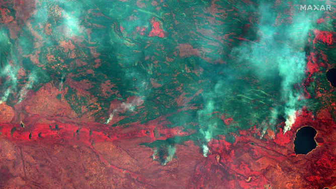 A satellite image showing wildfires near Dogface Lake in Canada.