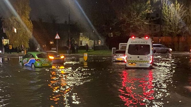 Stranded vehicles in flood water.