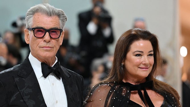 Irish actor Pierce Brosnan and his wife Keely Shaye Smith arrive for the 2023 Met Gala at the Metropolitan Museum of Art on May 1, 2023, in New York.