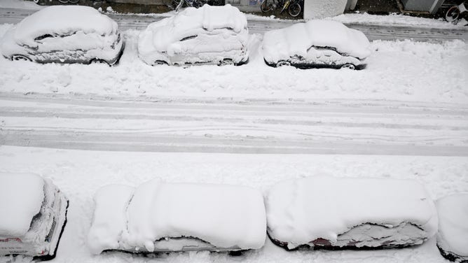 dpatop - 02 December 2023, Bavaria, Munich: Masses of snow lie on cars and a road in the state capital. Snow and ice have caused chaos on the roads and on the railroads in the south of Bavaria. Photo: Felix Hörhager/dpa (Photo by Felix Hörhager/picture alliance via Getty Images)