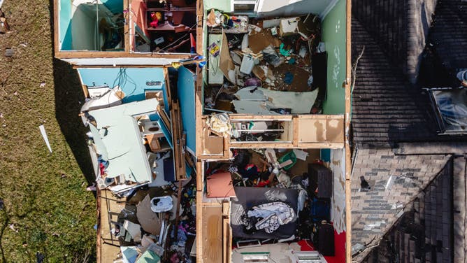 In an aerial view, the interior of a home is seen after its roof has been torn off in the aftermath of a tornado on December 10, 2023 in Madison, Tennessee.