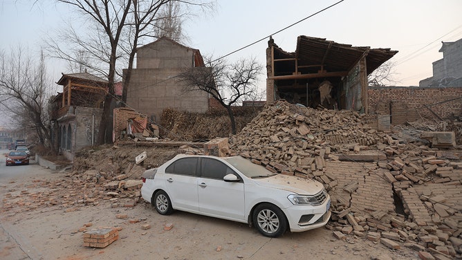 Collapsed buildings are seen after an earthquake in Dahejia, Jishishan County, in northwest China's Gansu province on December 19, 2023.