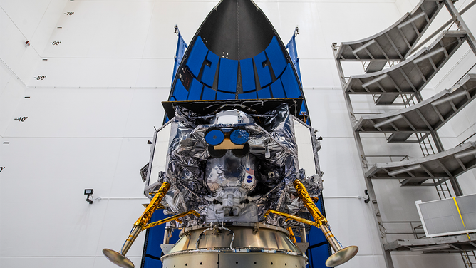 Astrobotic Peregrine lander integrated with ULA's Vulcan rocket fairing.