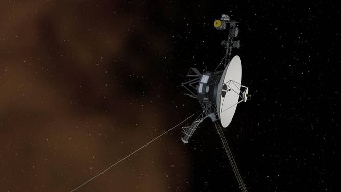 An artist's concept of Voyager 1 entering interstellar space, or the space between the stars. Interstellar space is filled with plasma, ionized gas (shown as a brownish haze here), that was cast off by giant stars millions of years ago, NASA said.