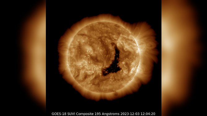 A coronal hole seen in the dark area of the Sun.