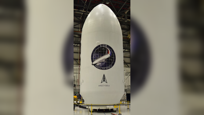 Featuring the United States Space Force (USSF) logo for the first time, the encapsulated X-37B Orbital Test Vehicle for the USSF-52 Mission. (Courtesy photo from Boeing)