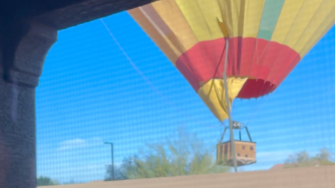 The moment a streetlamp punctures the balloon.