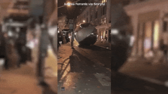 Giant baubles roll down a busy London street in 2002