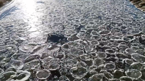 Watch: Aerial footage shows pancake ice floating down Minnesota river