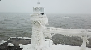 Drone video gives haunting view of historic Michigan lighthouse encased in ice
