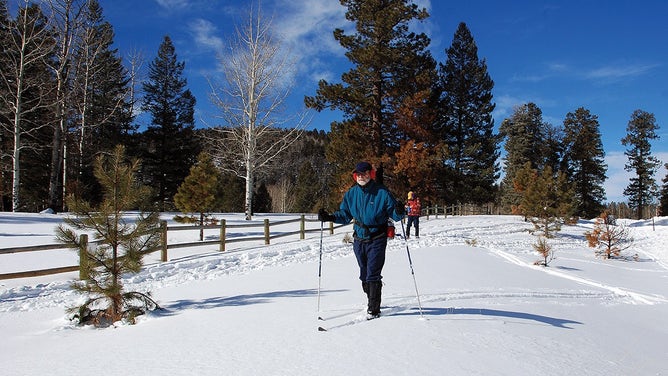 Park visitors enjoy the snowy trail.