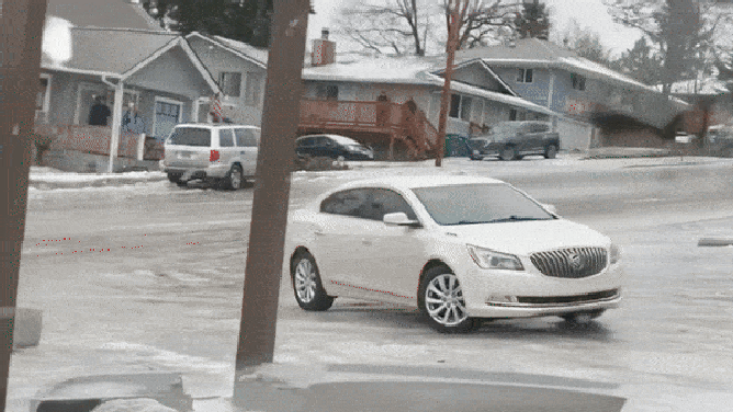 A white Buick slides toward a traffic post in Milwaukie, Oregon. Jan. 17, 2024.