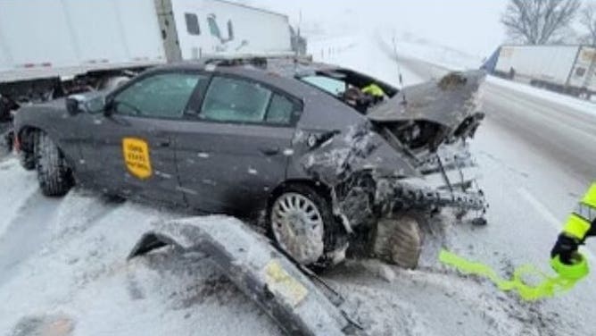On Interstate 80 near mile marker 203, an Iowa State Trooper vehicle was struck from behind, while a trooper was out checking on a stalled semi-truck. No injuries were reported. Jan. 9, 2024.