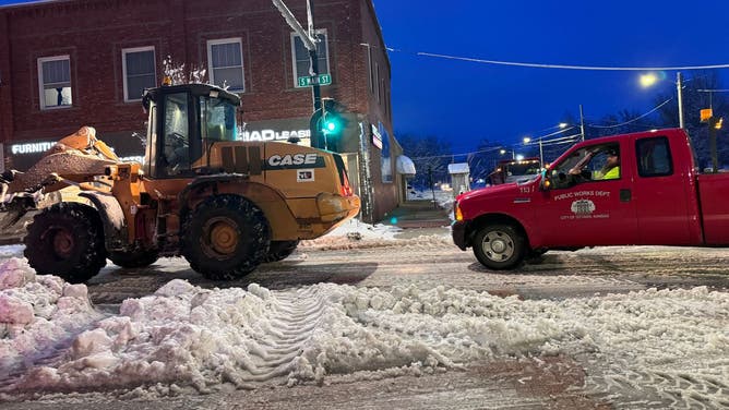 City crews clearing snow in Ottawa, Kansas, on Tuesday night. Jan. 9, 2024.