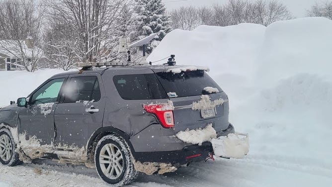 Copic's chasing vehicle, next to a snowpile in West Seneca, NY. Jan. 18, 2024.