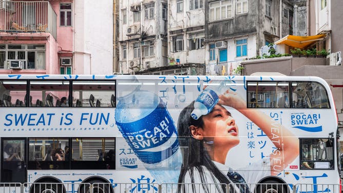 A bus displays a commercial advertisement of the Japanese sports drink manufactured by Otsuka Pharmaceutical, Pocari Sweat, in Hong Kong.