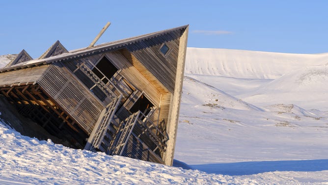 Modern hut, damage due to melting permafrost. Landscape in Groenfjorddalen, Island of Spitsbergen, part of Svalbard archipelago. Arctic region, Europe, Scandinavia, Norway, Svalbard. (Photo by: Martin Zwick/REDA&amp;CO/Universal Images Group via Getty Images)