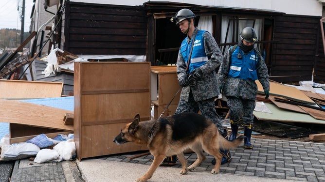 WAJIMA, JAPAN - JANUARY 05: Members of the Self Defense Forces search for survivors in the aftermath of an earthquake on January 05, 2024 in Wajima, Japan. On New Year's Day, a series of major earthquakes reportedly killed at least 92 people, injured dozens more and destroyed a large amount of homes. The earthquakes, the biggest measuring 7.1 magnitude, hit the areas around Ishikawa, Toyama and Niigata in central Japan. (Photo by Tomohiro Ohsumi/Getty Images)