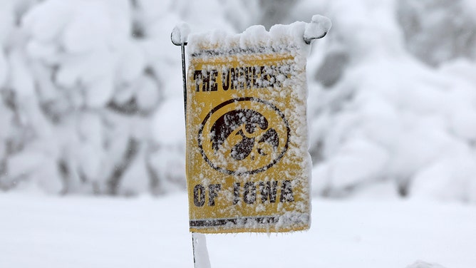 Snow covers a University of Iowa sign as a snowstorm dumps several inches of snow on the area on January 09, 2024 in Des Moines, Iowa.