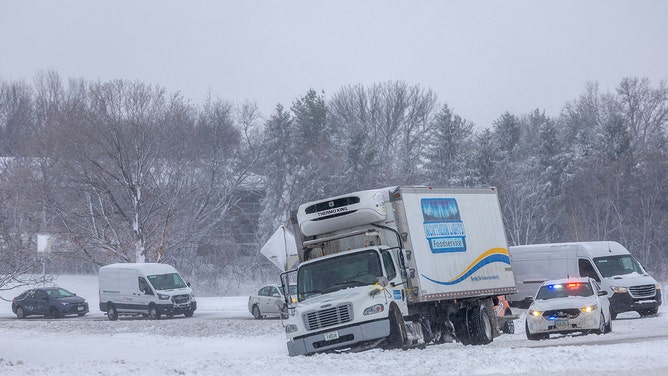 Crews work to free stuck vehicles on I-80 as a snowstorm dumps several inches of snow on the area on January 09, 2024 in Des Moines, Iowa.