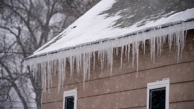 Icicles on a house during a winter storm ahead of the Iowa caucus in West Des Moines, Iowa, US, on Friday, Jan. 12, 2024.