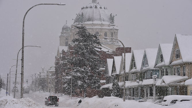 The Our Lady Of Victory National Shrine and Basilica is covered in snow along South Park Avenue on January 18, 2024 in Lackawanna, New York.