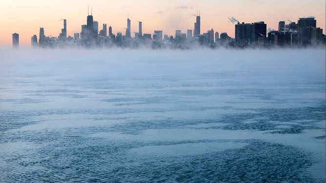 Morning sunrise over the city skyline and the steaming frigid waters of Lake Michigan at Montrose Beach on Jan. 16, 2024, in Chicago.