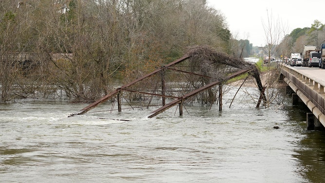 A historic metal truss bridge along FM 2854 known as the Bonnie and Clyde Bridge is shown Thursday, Jan. 25, 2024, in Conroe. It collapsed into the San Jacinto River from floodwaters.