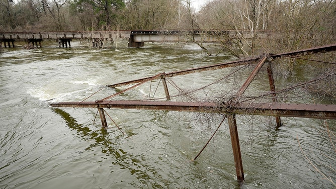 A historic metal truss bridge along FM 2854 known as the Bonnie and Clyde Bridge is shown Thursday, Jan. 25, 2024, in Conroe. It collapsed into the San Jacinto River from floodwaters.