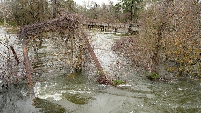 A historic metal truss bridge along FM 2854 known as the Bonnie and Clyde Bridge is shown Thursday, Jan. 25, 2024, in Conroe. It collapsed into the San Jacinto River from floodwaters.
