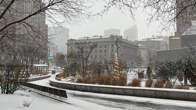 Snow falls in Cleveland, Ohio on Jan. 19, 2024.