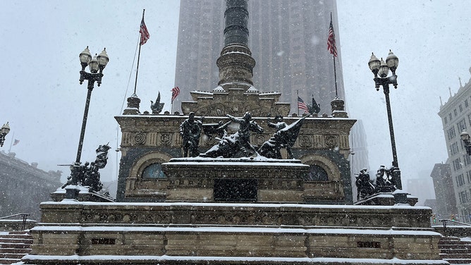 Snow falls in Cleveland, Ohio on Jan. 19, 2024.