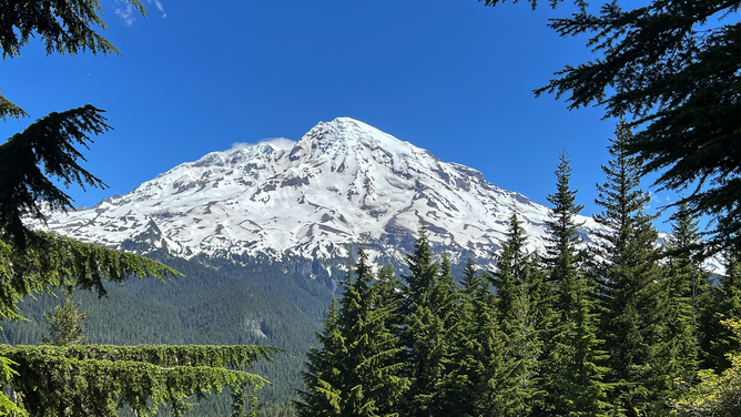 FILE - Mount Rainier viewed from the Longmire Viewpoint on the Wonderland Trail in Mt Rainier National Park on Tuesday, June 28 2022. Ascending to 14,410 feet above sea level, Mount Rainier stands as an icon in the Washington landscape. An active volcano, Mount Rainier is the most glaciated peak in the contiguous U.S.A., spawning five major rivers. l Photo by Tom O'Neill (Photo by Thomas O'Neill/NurPhoto via Getty Images)