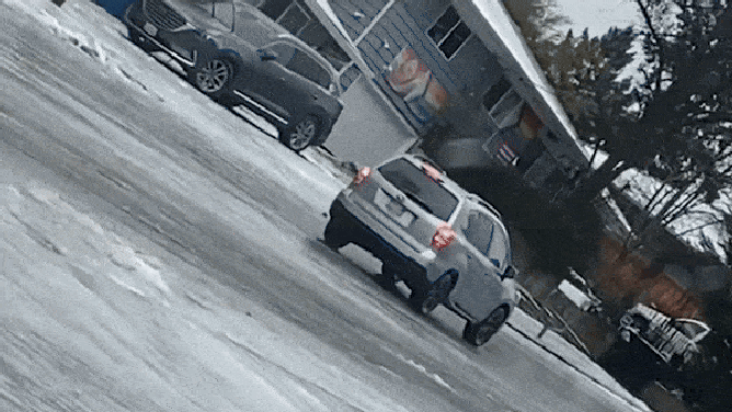 An SUV slides and hits a parked vehicle. 
