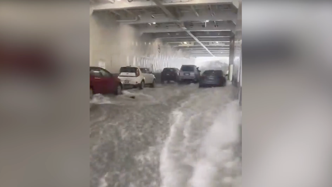Water floods into compartment where vehicles are parked. 