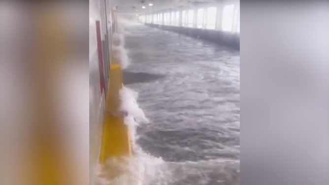Water overflows into other parts of the ferry boat.