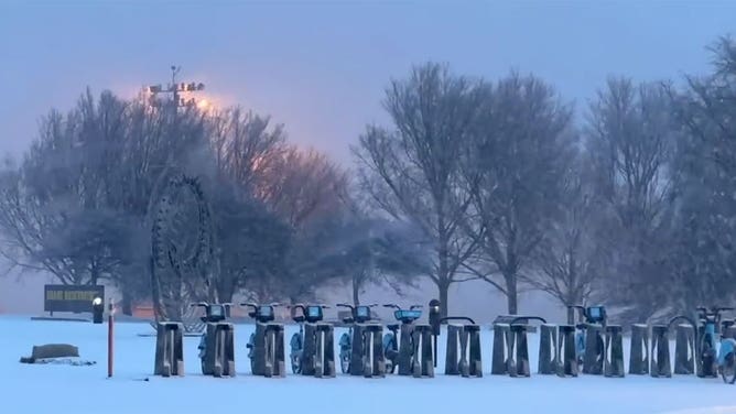 Snow falls in Chicago, Illinois, on Jan. 12, 2024.