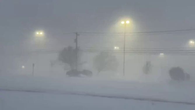 A photo from Cheektowaga, New York, shows whiteout conditions due to heavy snow and wind. Portions of the Great Lakes region, including Buffalo and Watertown, could pick up feet of snow due to relentless bands of lake-effect snow.