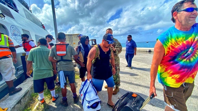Roi-Namur residents depart the catamaran after their four-hour journey to Kwajalein on Jan. 21.