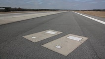 Husband, wife buried on runway at US airport greet thousands of planes every year