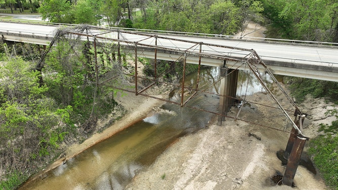 The bridge was constructed in 1910, according to county and state records, and served as the old Highway 105 bridge running from Conroe to Montgomery.