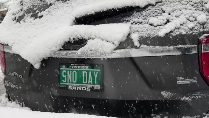One driver parked on snow-covered streets in Brooklyn, New York said it best with their Vermont license plate: ‘SNO DAY’, as a nor’easter struck the Northeast on Feb. 13, 2024.