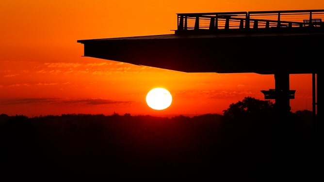 INDIANAPOLIS, IN - MAY 29: The sun come up behind the pagoda prior to the 106th running of the NTT IndyCar Series Indianapolis 500 on May 29, 2022, at the Indianapolis Motor Speedway in Indianapolis, Indiana. (Photo by Jeffrey Brown/Icon Sportswire via Getty Images)