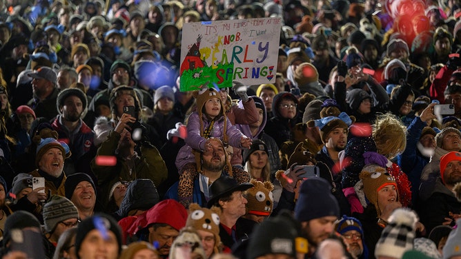 An estimated crowd of over 40,000 watches Punxsutawney Phil after he did not see his shadow predicting an early Spring during the 138th annual Groundhog Day festivities on Friday February 2, 2024 in Punxsutawney, Pennsylvania.