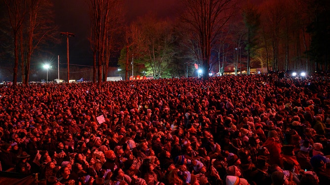 An estimated crowd of over 40,000 watches Punxsutawney Phil after he did not see his shadow predicting an early Spring during the 138th annual Groundhog Day festivities on Friday February 2, 2024 in Punxsutawney, Pennsylvania.