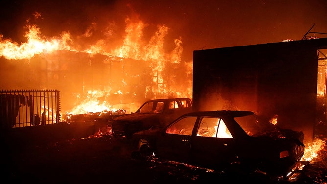 Vehicles and homes burn during a fire in Viña del Mar, Chile, on Friday, Feb. 2, 2024.