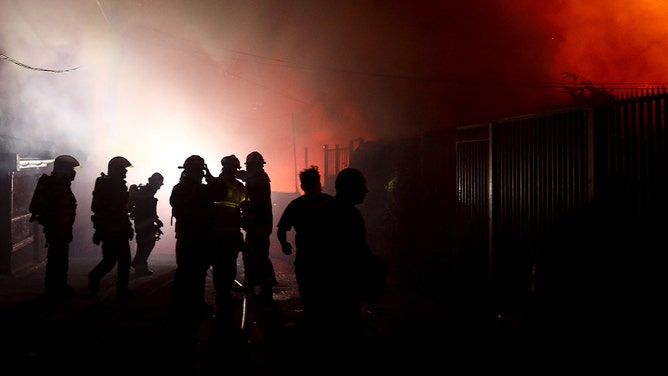 Firefighters work on extinguishing the fire that broke out in Valparaiso, Chile on Friday, Feb. 2,2024.