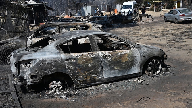 View of burnt vehicles after a fire that affected the hills in Quilpue comune, Viña del Mar, Chile on February 3, 2024.